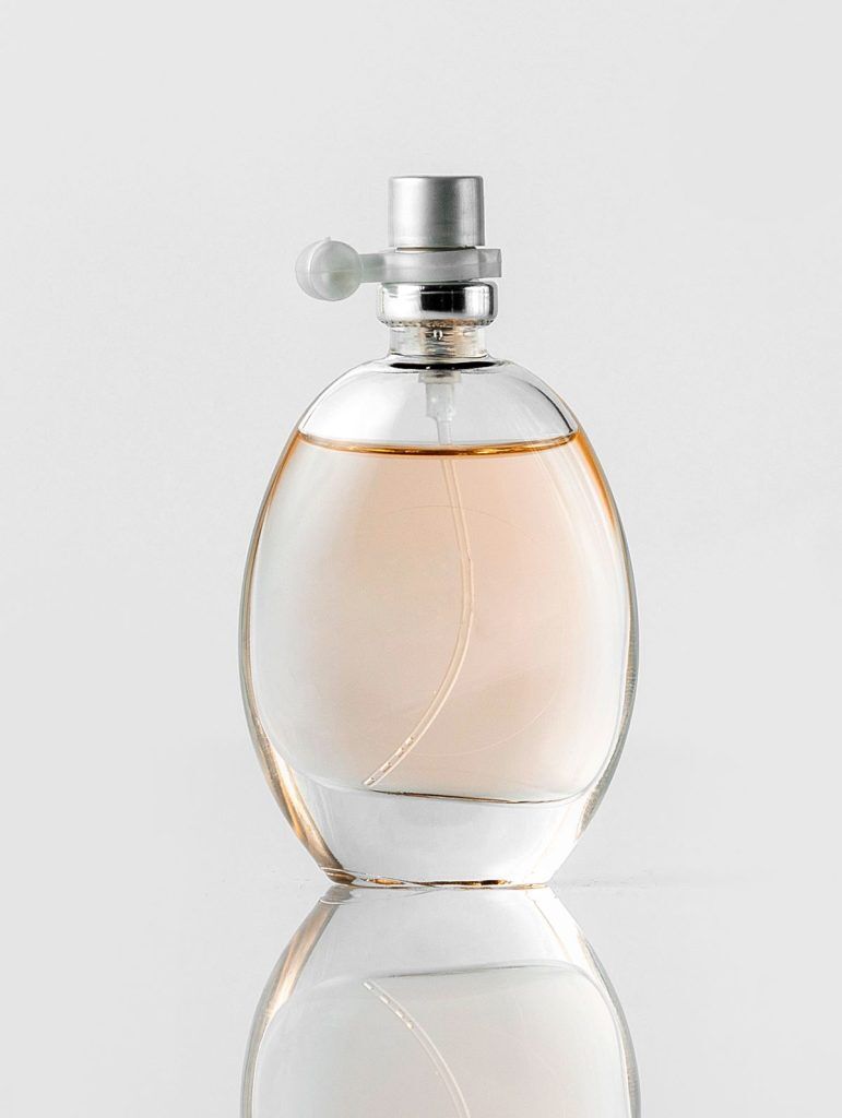 front view fragrance bottle transparent white floor